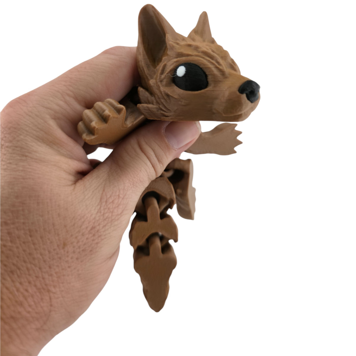 Brown Tiny Wolf Pup held in hand for scale