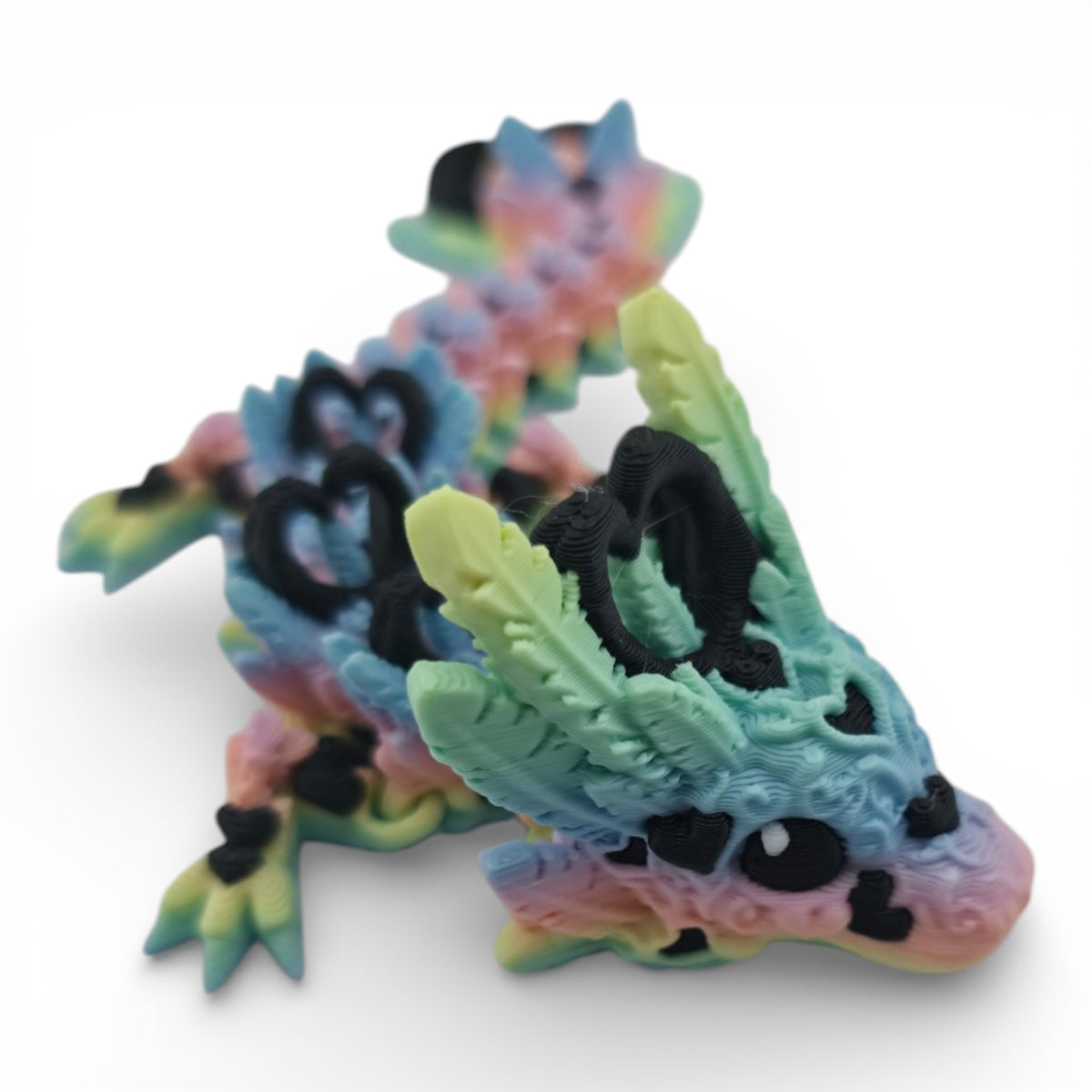 Pastel Rainbow and Black Light Heart Baby Dragon angled view