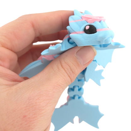 Cotton Candy Rose Tiny Dragon held in hand for scale