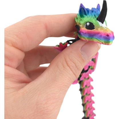 Unicorn Baby Dragon held in hand for scale