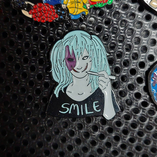 Enamel Pin: Mysterious Figure with 'SMILE' Shirt Design